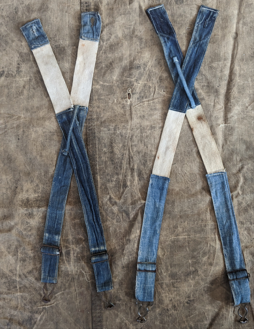 Early 1900s overalls with strap extension.